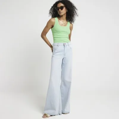 Green fluorescent scoop neck vest top sold by River Island