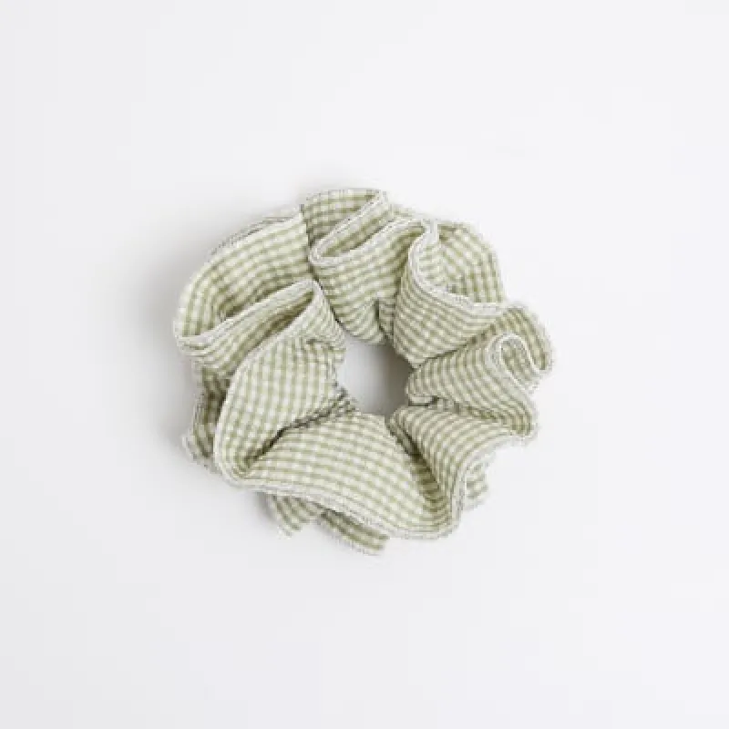 Green stripe hair scrunchie sold by River Island