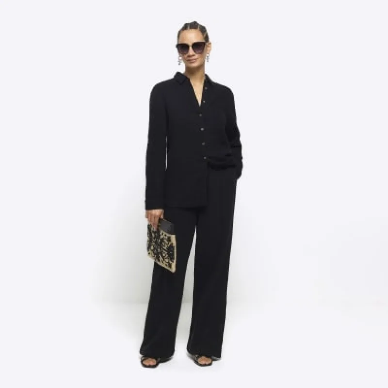 Black textured wide leg trousers sold by River Island