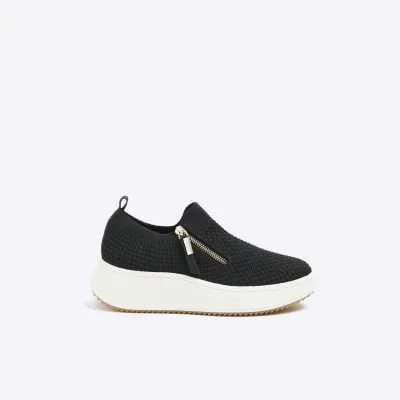 Black knitted wedge trainers sold by River Island