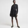 Black broderie belted mini shirt dress sold by River Island