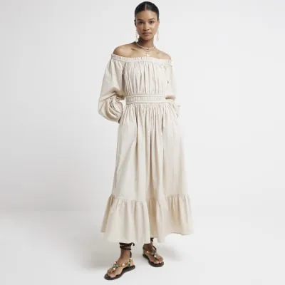 Beige ruched bardot swing midi dress sold by River Island