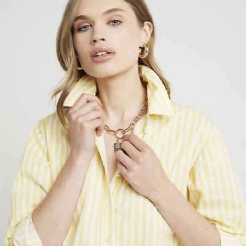 Yellow stripe poplin cropped shirt sold by River Island