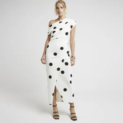Cream spot drape bodycon midi dress sold by River Island