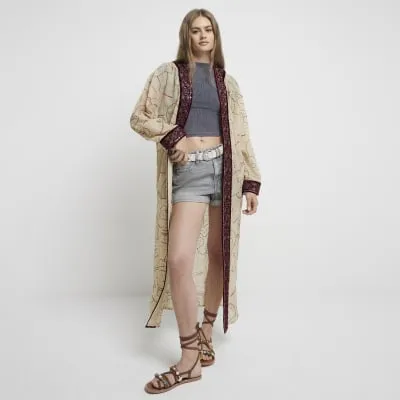 Beige embroidered sequin kimono top sold by River Island