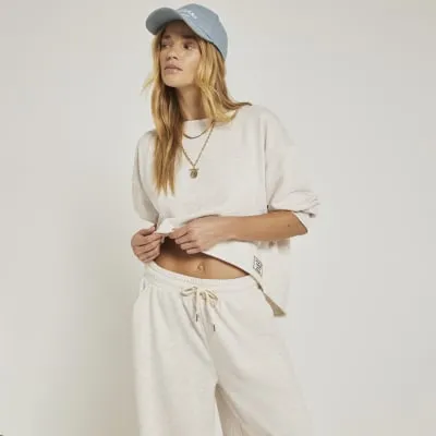 Beige boat neck crop sweatshirt sold by River Island