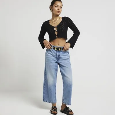 Petite black crochet cardigan sold by River Island