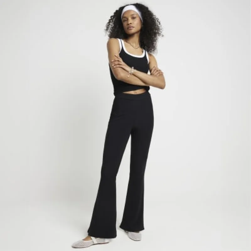 Black rib flared leggings sold by River Island