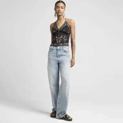 Black sequin embellished cami top sold by River Island