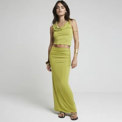 Green cowl neck top sold by River Island