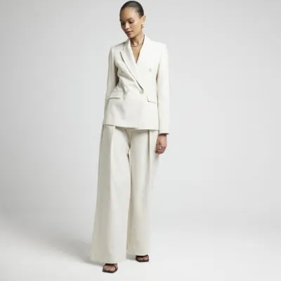 Beige linen blend wide leg trousers sold by River Island