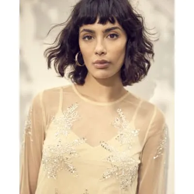 Beige mesh embellished long sleeve top sold by River Island