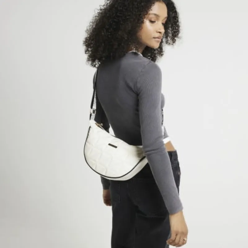 Cream soft quilted cross body bag sold by River Island