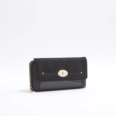 Black embossed RI monogram purse sold by River Island