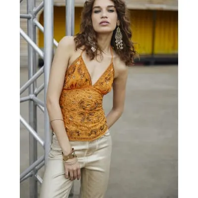 Orange sequin embellished cami top sold by River Island