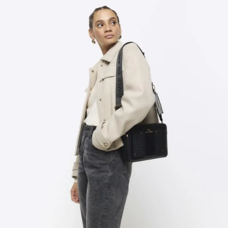 Black RI monogram boxy cross body bag sold by River Island
