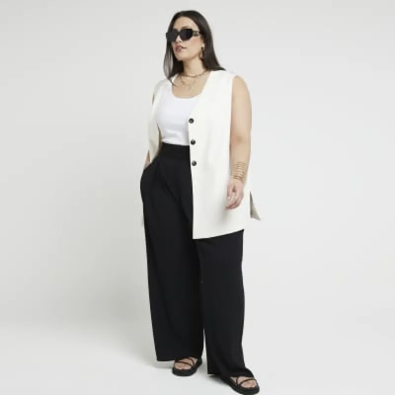 Plus black wide leg pleated trousers sold by River Island