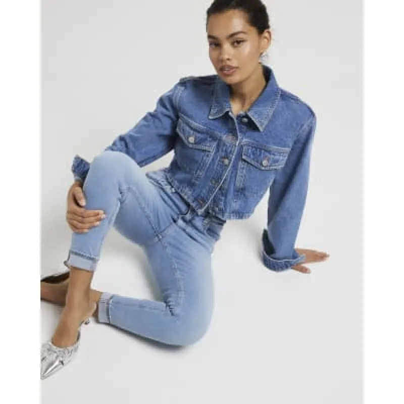 Petite blue bum sculpt skinny jeans sold by River Island