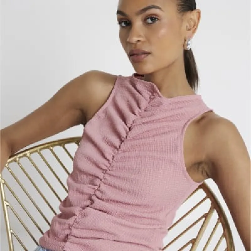 Pink textured ruched tank top sold by River Island