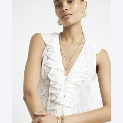 Cream embroidered frill blouse sold by River Island