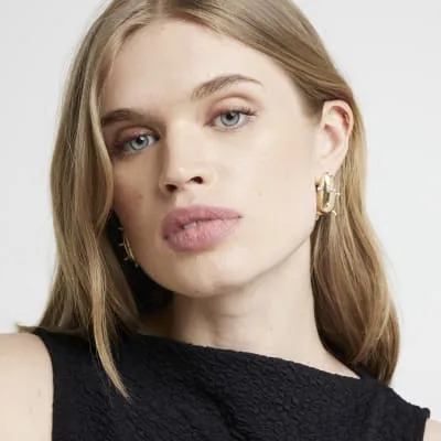 Gold pearl domed earrings sold by River Island