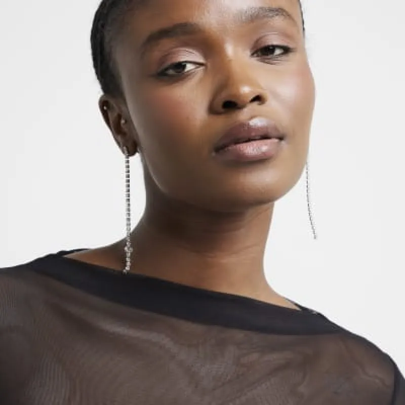 Silver diamante drop earrings sold by River Island