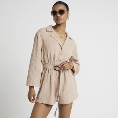 Brown textured belted playsuit sold by River Island