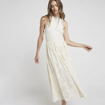 Beige broderie cross neck smock midi dress sold by River Island