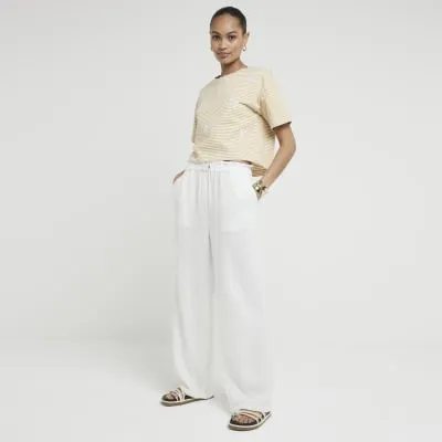 Yellow stripe embroidered cropped t-shirt sold by River Island