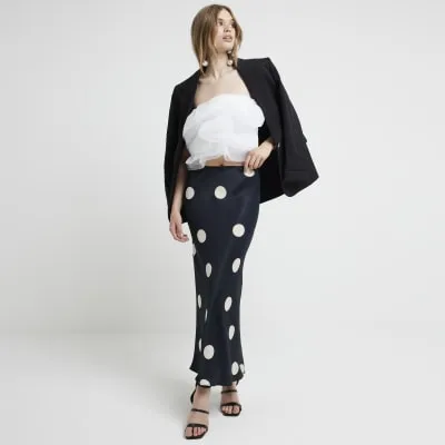 Black satin spot maxi skirt sold by River Island