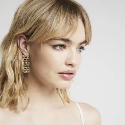 Gold Watch Strap Drop Earrings sold by River Island