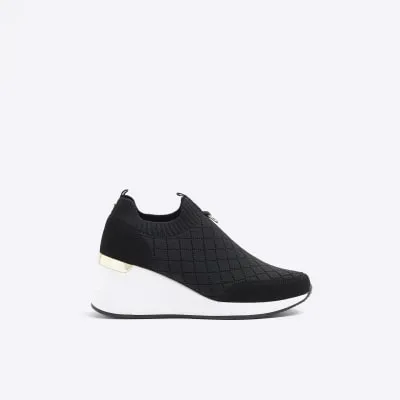 Black wide fit quilted wedge trainers sold by River Island