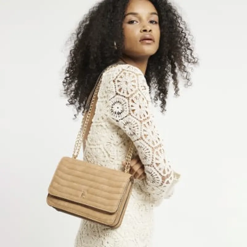 Brown quilted chain shoulder bag sold by River Island