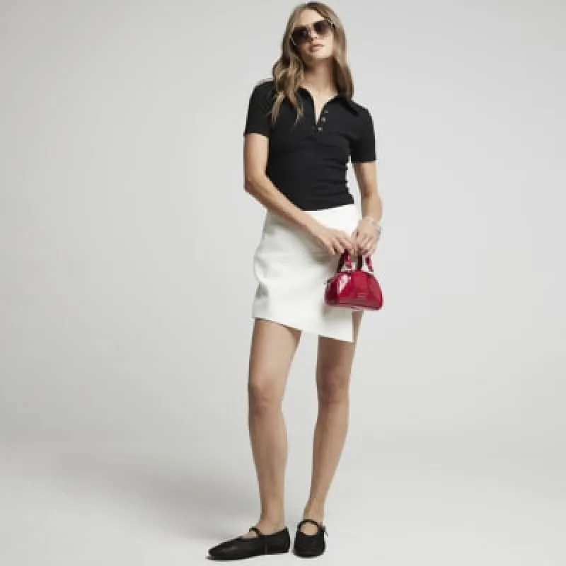Cream knot wrap mini skort sold by River Island