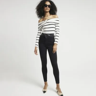 Black high waisted bum sculpt skinny jeans sold by River Island