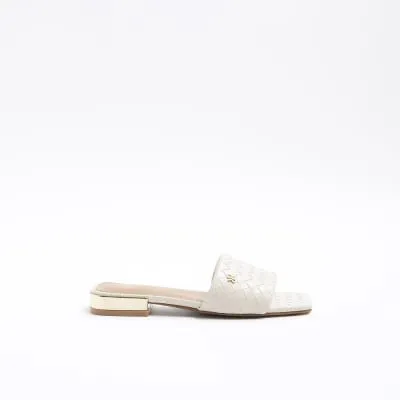 Cream woven flat sandals sold by River Island