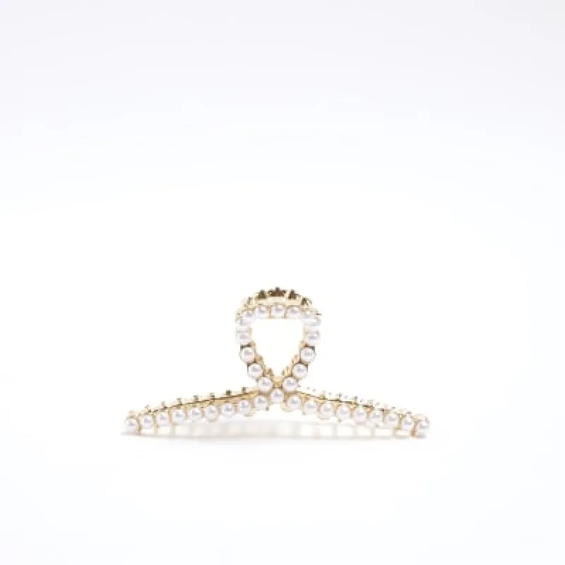 Gold pearl detail hair claw clip sold by River Island