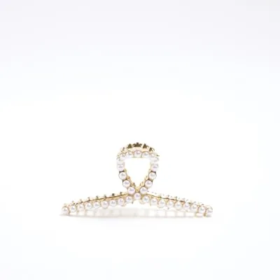 Gold pearl detail hair claw clip sold by River Island