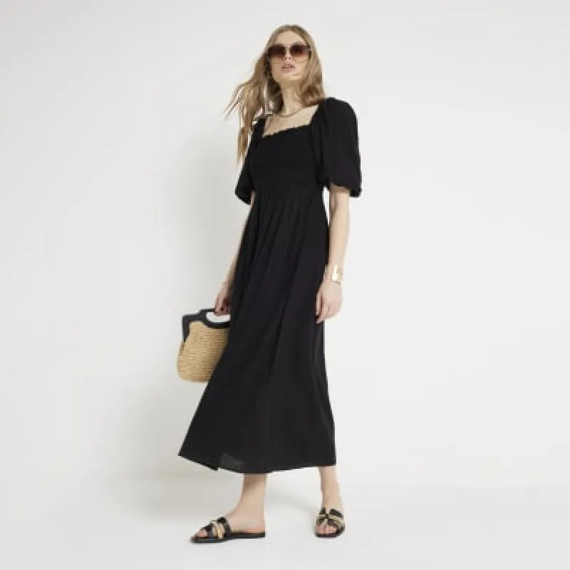 Black puff sleeve smock midi dress sold by River Island