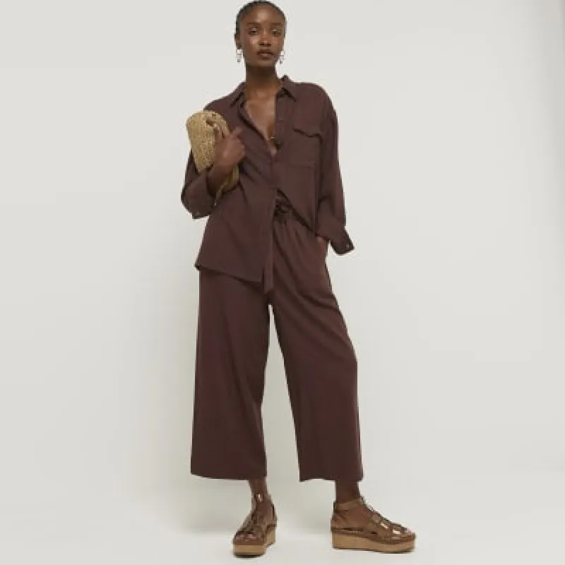 Brown linen blend belted wide leg trousers sold by River Island