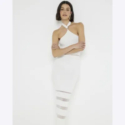 Cream knitted knot front bodycon midi dress sold by River Island