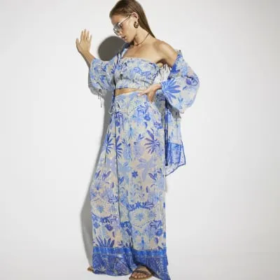 Blue floral chiffon beach trousers sold by River Island