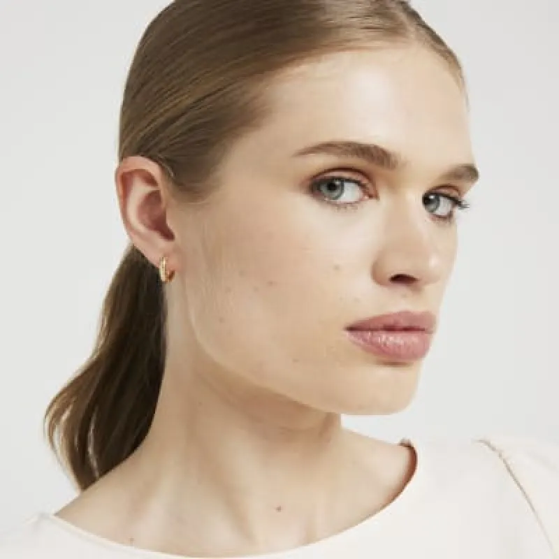 Gold Plated Textured Mini Hoop Earrings sold by River Island