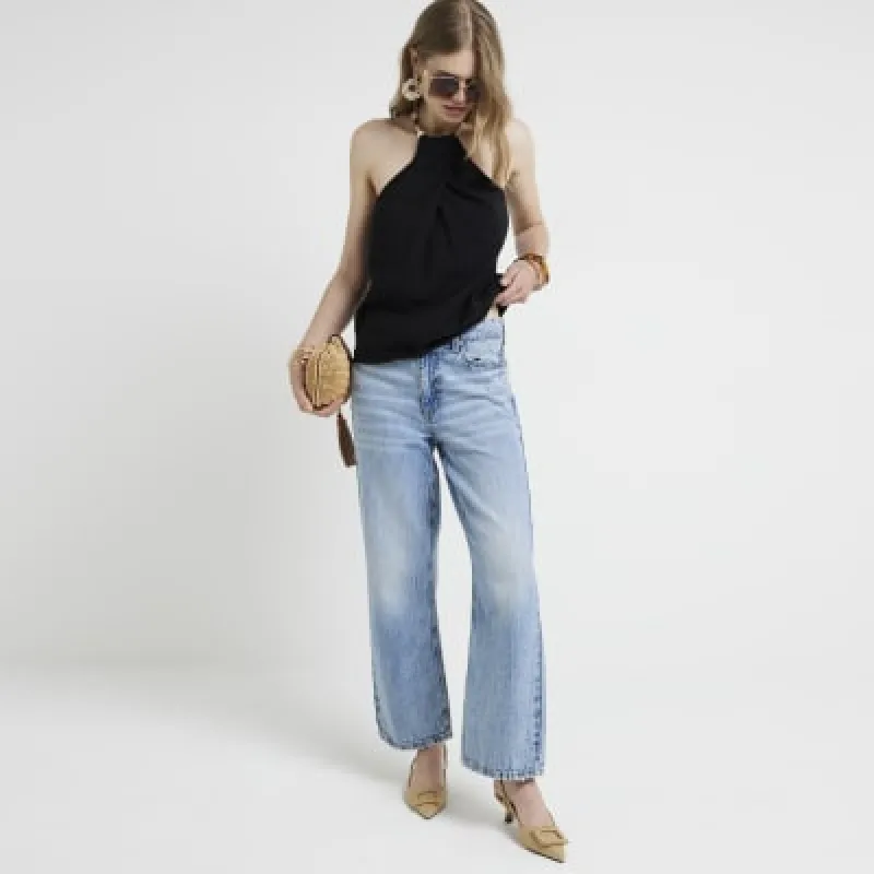 Black shell strap halter neck top sold by River Island
