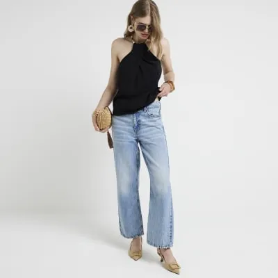 Black shell strap halter neck top sold by River Island