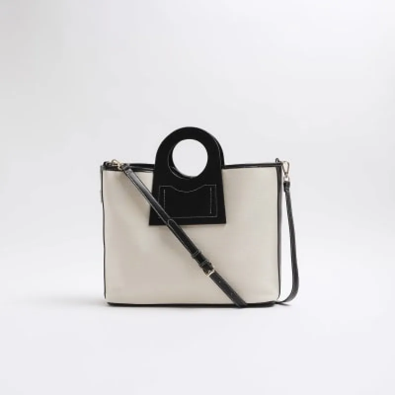White canvas circle handle tote bag sold by River Island