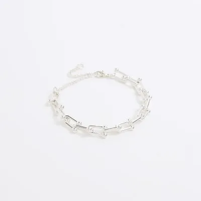 Silver chain link bracelet sold by River Island