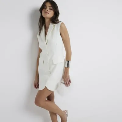 Cream blazer mini dress sold by River Island