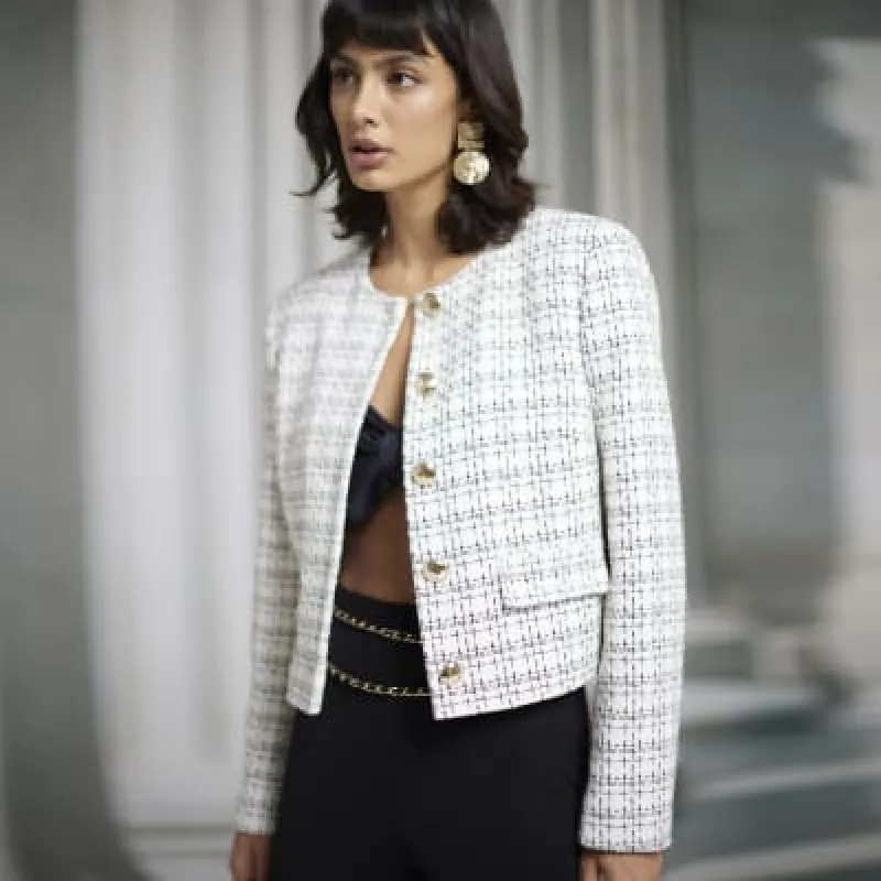 White boucle crop trophy jacket sold by River Island