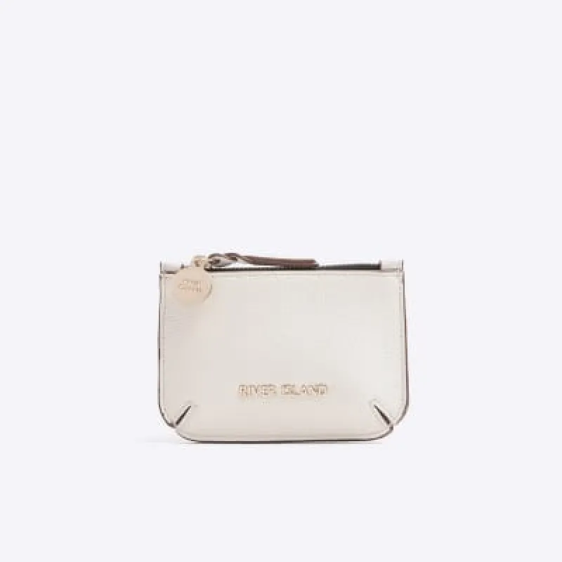 Cream textured pouch purse sold by River Island
